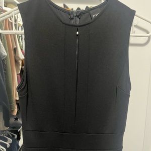 Black sleeveless jumpsuit with slit in front. Very flattering and comfortable.